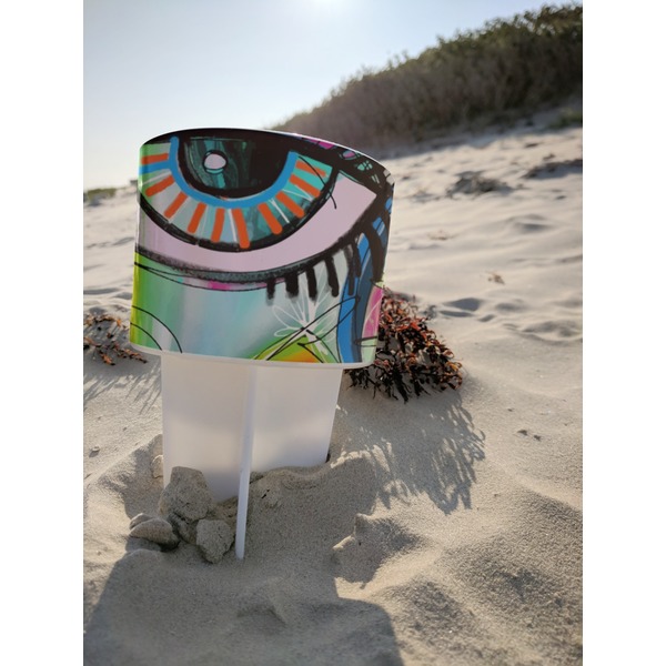 Abstract Eye Painting Beach Spiker white on beach with sand