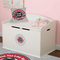 Logo & Tag Line Round Wall Decal on Toy Chest