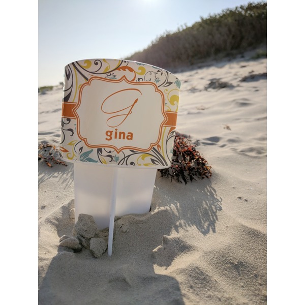 Swirly Floral Beach Spiker white on beach with sand