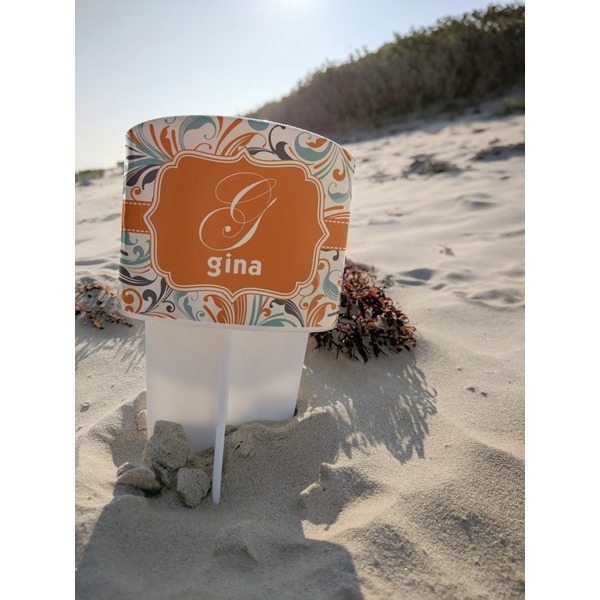 Orange & Blue Leafy Swirls Beach Spiker white on beach with sand