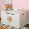 Orange & Blue Stripes Round Wall Decal on Toy Chest