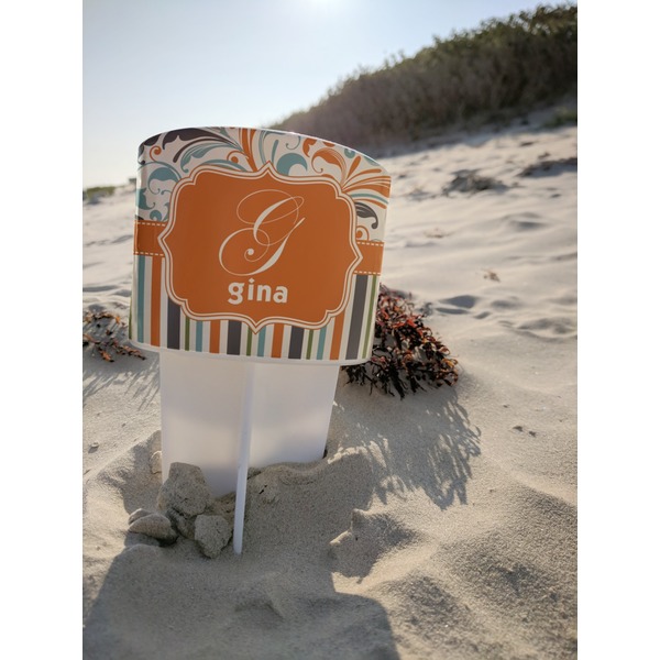 Orange Blue Swirls & Stripes Beach Spiker white on beach with sand