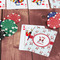 Santa Clause Making Snow Angels On Table with Poker Chips