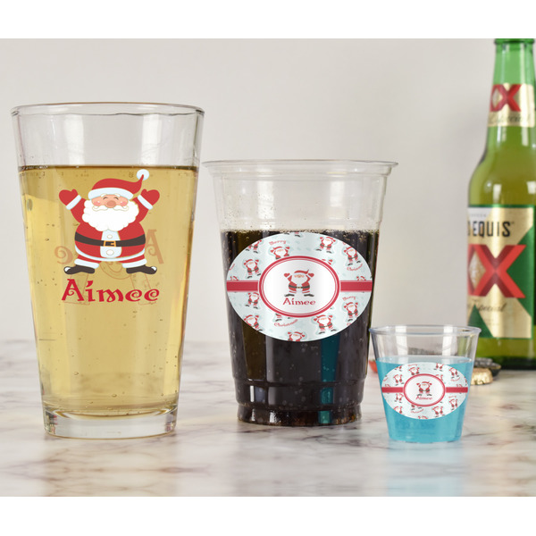 Santa Clause Making Snow Angels Pint Glass - Two Content - In Context