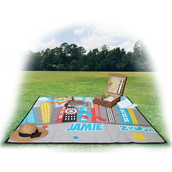 Superhero in the City Picnic Blanket - with Basket Hat and Book - in Use