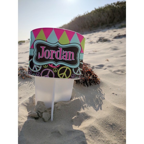 Harlequin & Peace Signs Beach Spiker white on beach with sand