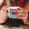 Harlequin & Peace Signs Espresso Cup - 6oz (Double Shot) LIFESTYLE (Woman hands cropped)