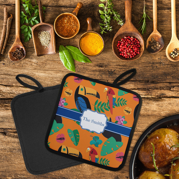 Toucans Neoprene Pot Holder - Set of 2  LIFESTYLE (Flatlay)