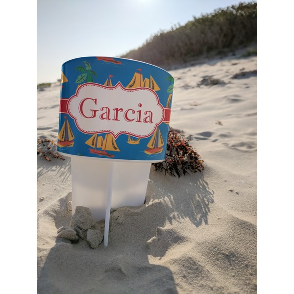 Boats & Palm Trees Beach Spiker white on beach with sand