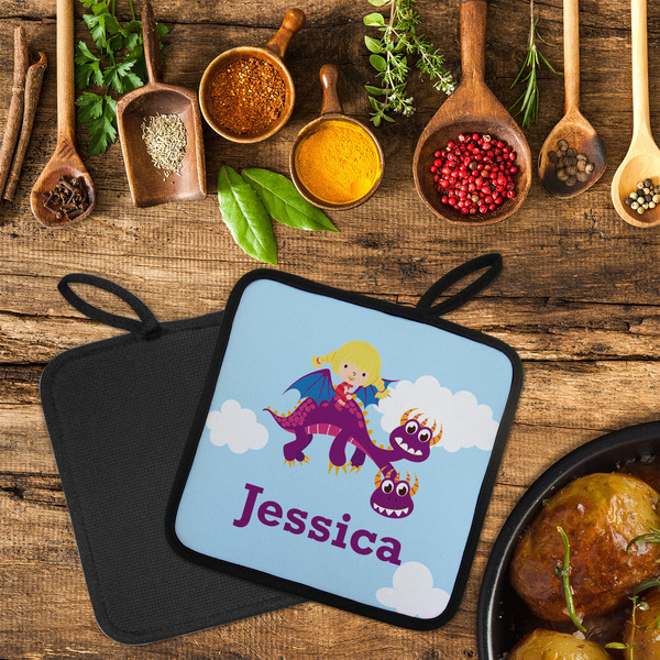 Girl Flying on a Dragon Neoprene Pot Holder - Set of 2  LIFESTYLE (Flatlay)