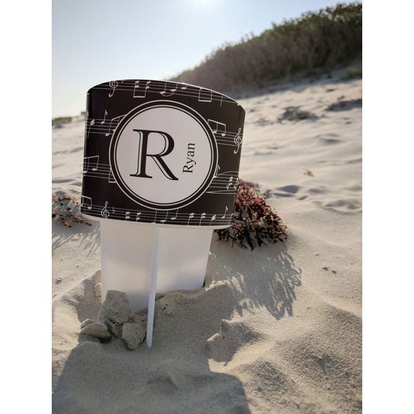 Musical Notes Beach Spiker white on beach with sand