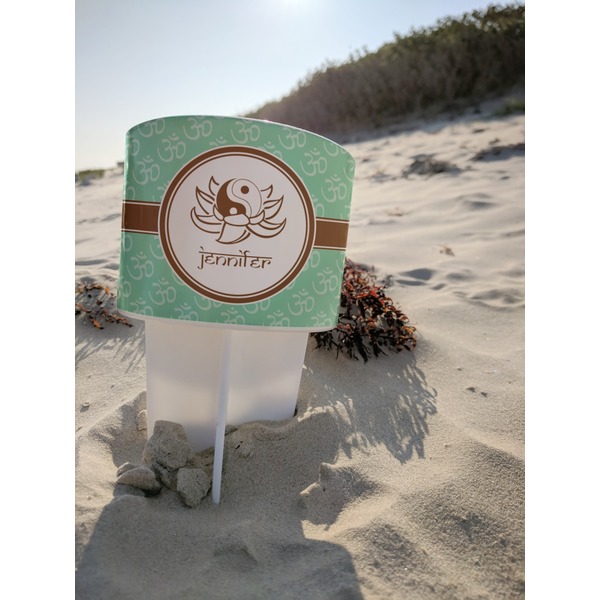 Om Beach Spiker white on beach with sand