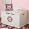 Maroon & White Round Wall Decal on Toy Chest