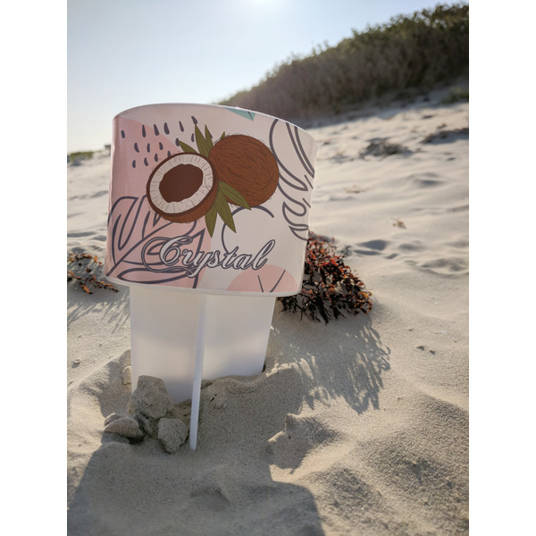 Coconut and Leaves Beach Spiker white on beach with sand