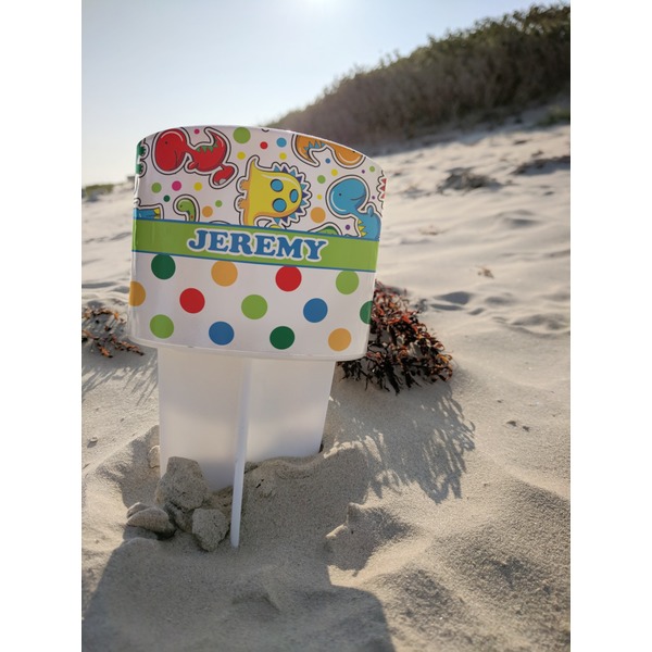Dinosaur Print & Dots Beach Spiker white on beach with sand