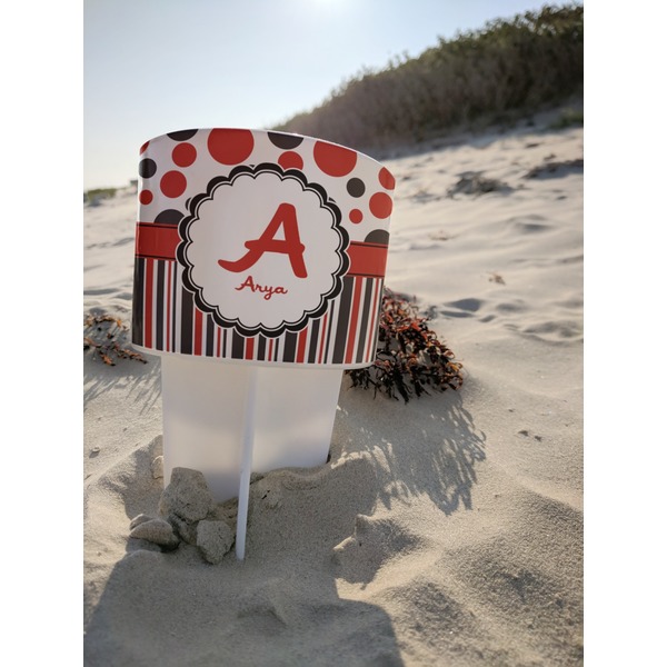 Red & Black Dots & Stripes Beach Spiker white on beach with sand
