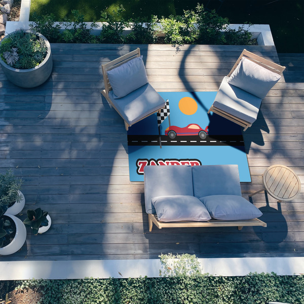 Race Car 5'x7' Patio Rug - In context