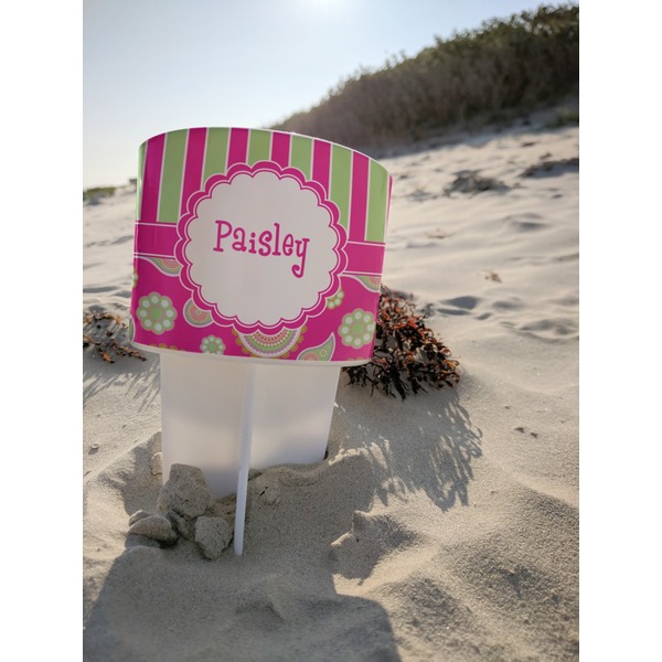 Pink & Green Paisley and Stripes Beach Spiker white on beach with sand