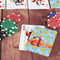 Rubber Duckies & Flowers On Table with Poker Chips
