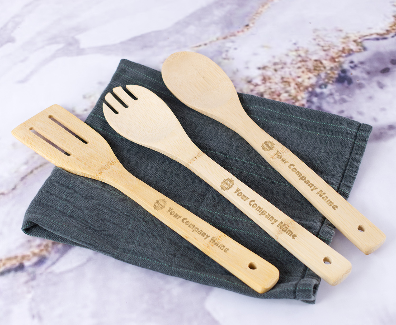 https://www.youcustomizeit.com/common/MAKE/638421/Logo-Company-Name-Bamboo-Cooking-Utensils-Set-In-Context.jpg?lm=1686953854