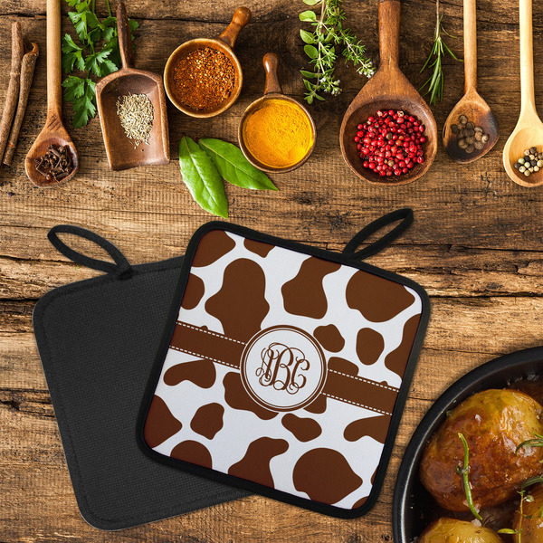 Cow Print Neoprene Pot Holder - Set of 2  LIFESTYLE (Flatlay)