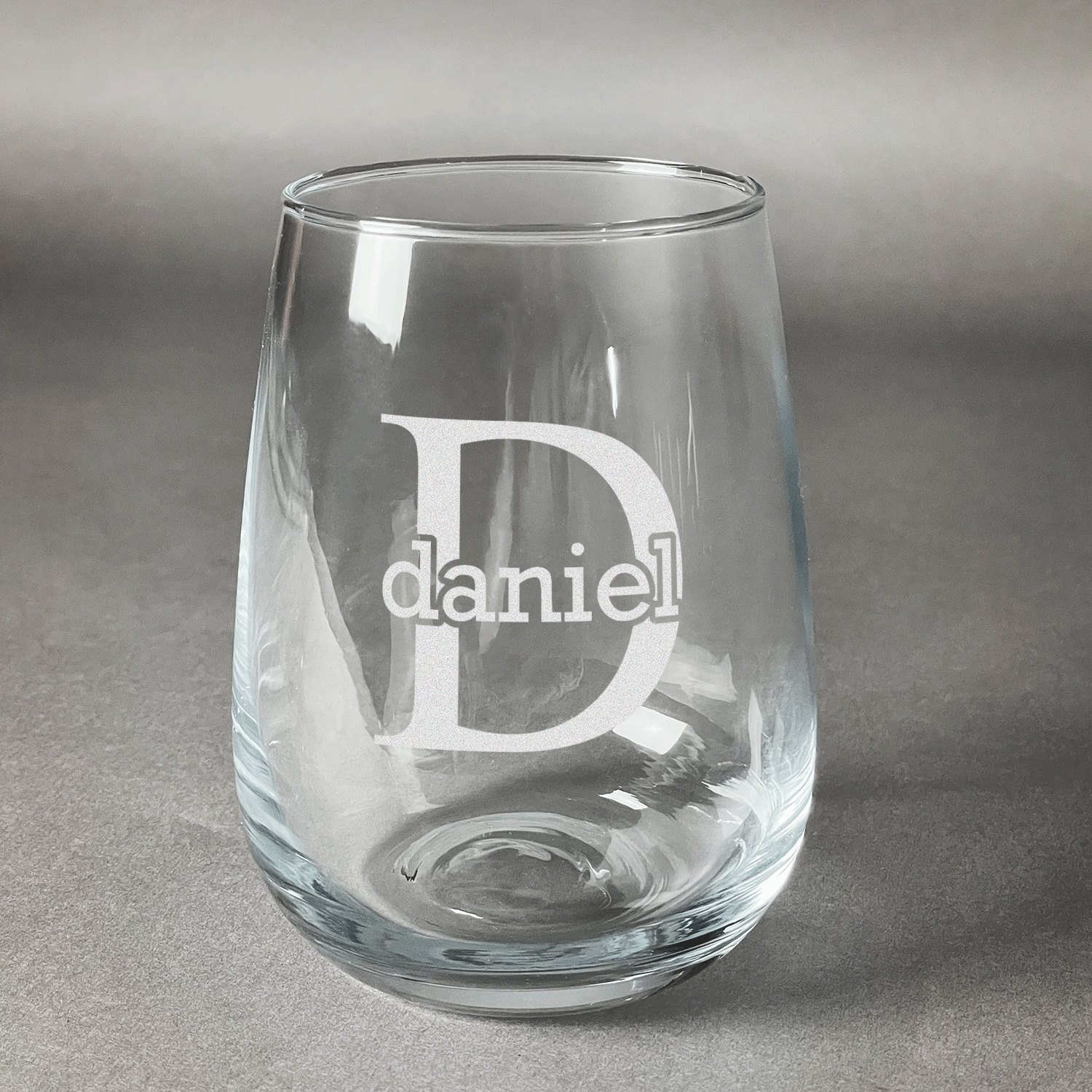 https://www.youcustomizeit.com/common/MAKE/837778/Name-Initial-for-Guys-Stemless-Wine-Glass-Front-Approval.jpg?lm=1682544394